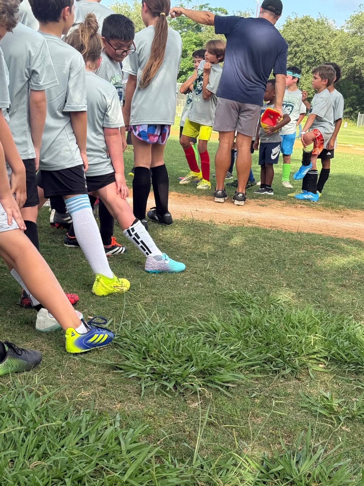 Coach helping a young player